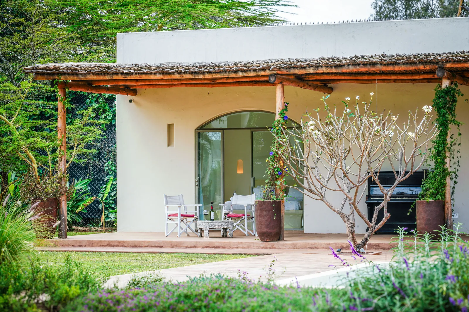 The front of the pool house at Nairobi Pool Nest, with creepers along the veranda