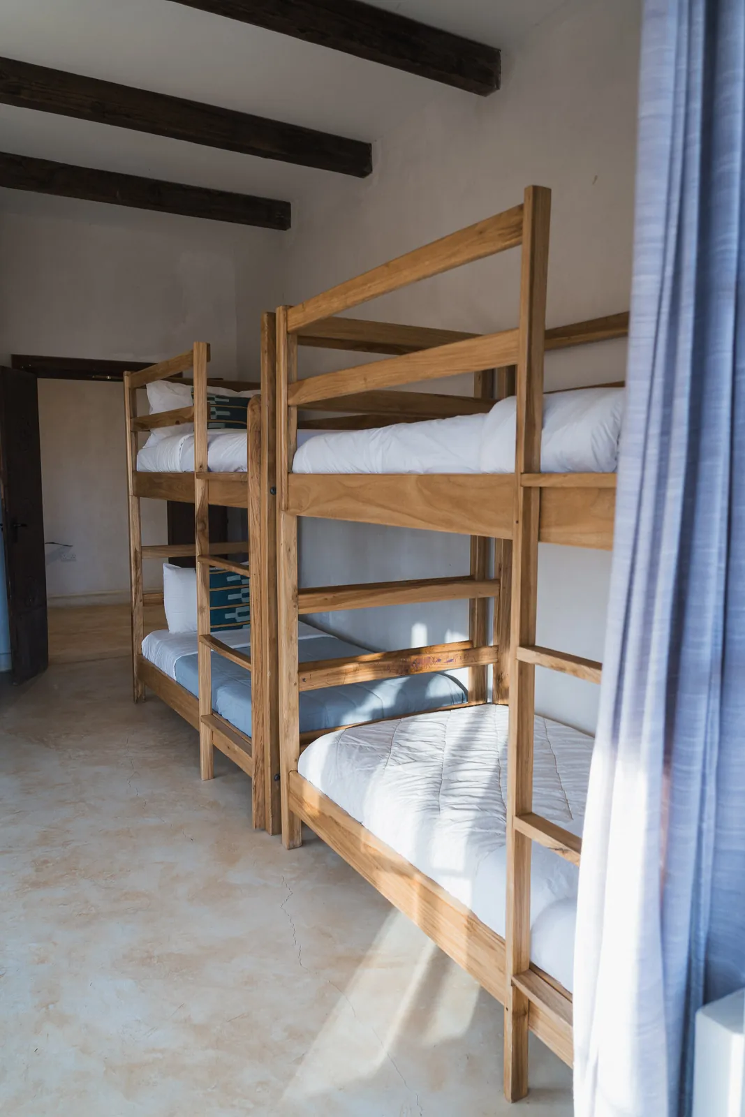 Wooden bunk beds in the bunk room at Lolldaiga Nest