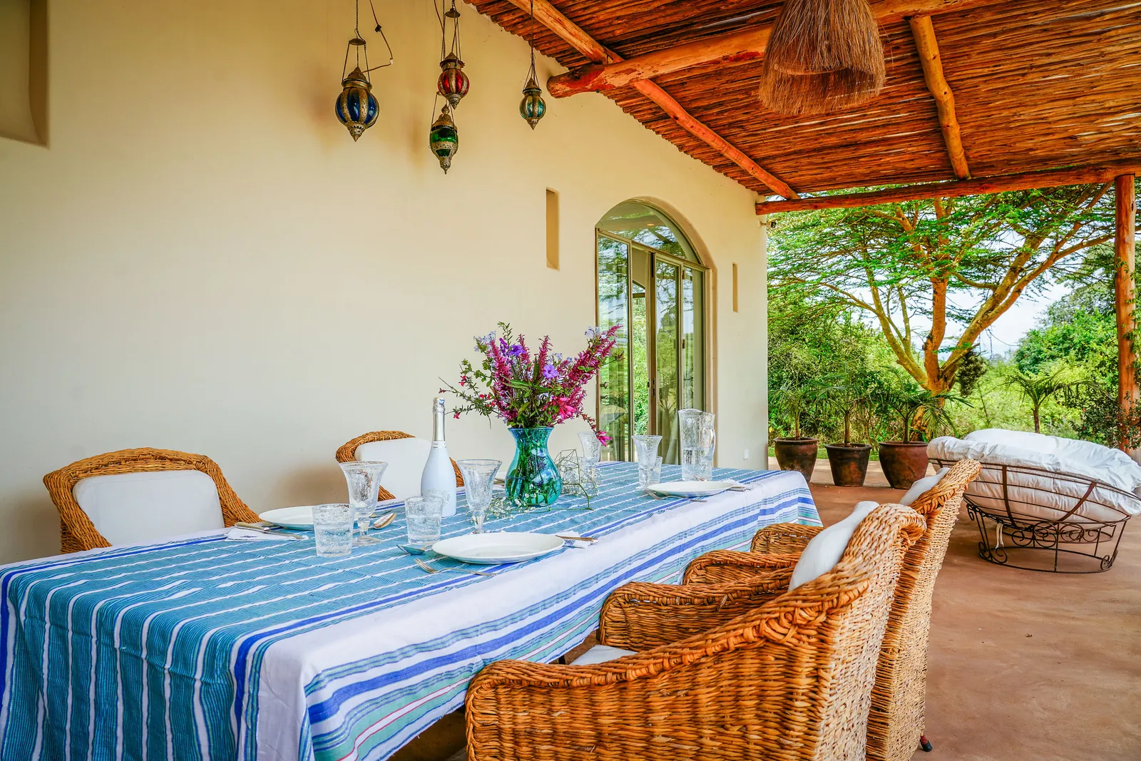 The veranda at Nairobi Pool Nest, laid for lunch beneath the timber roof