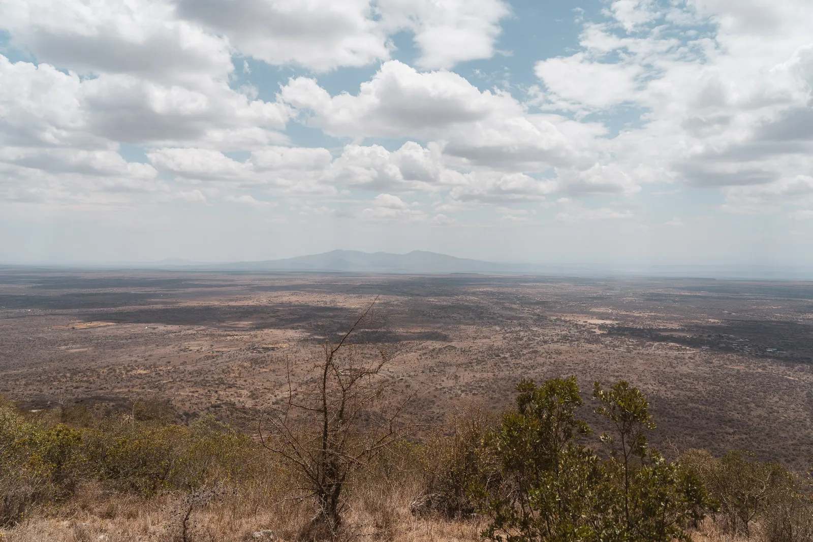 The floor of the Great Rift Valley stretching to distant hills, seen from the ridge at Champagne Ridge Nest