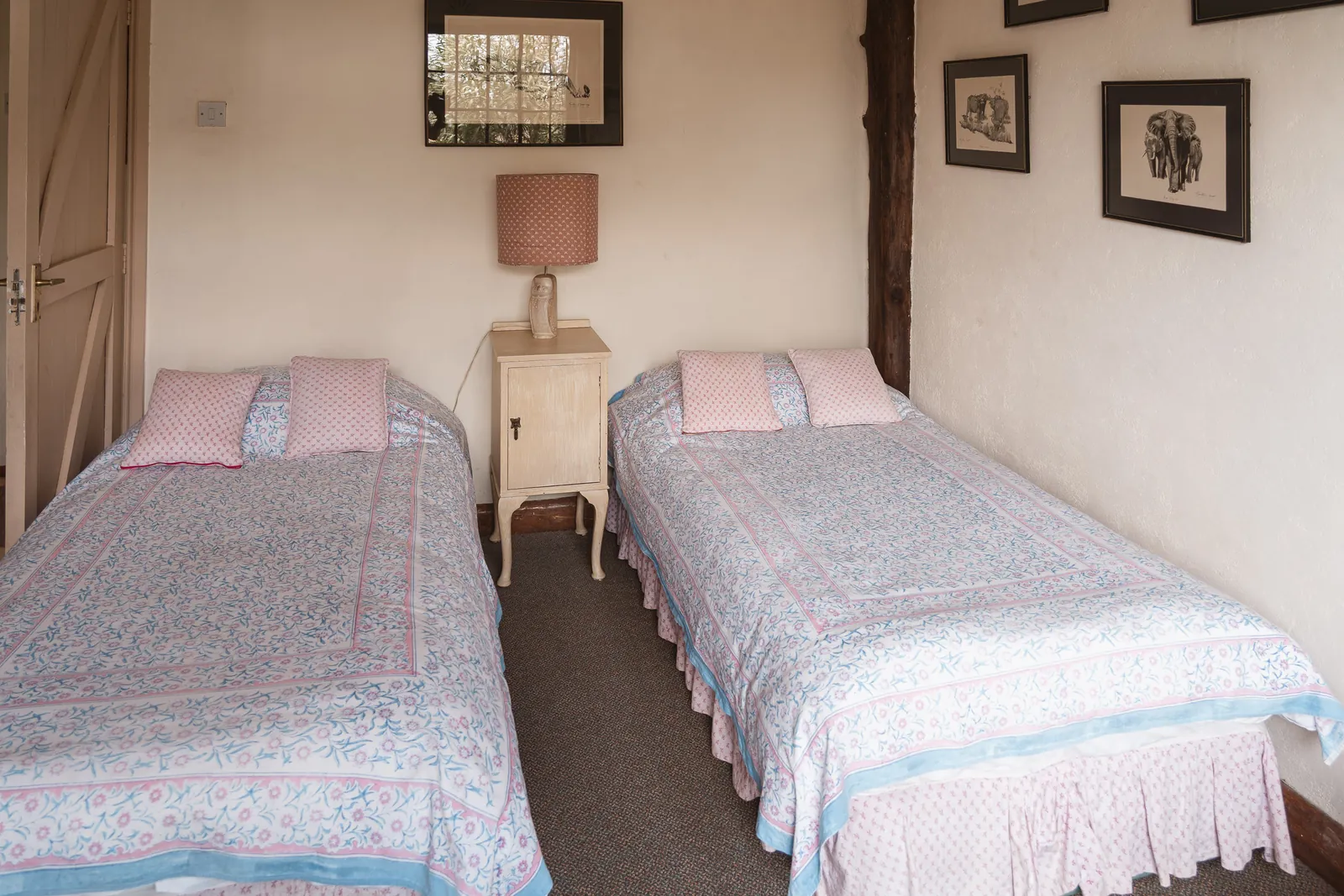 The twin bedroom at Champagne Ridge Nest, two single beds with pink and blue block-printed covers